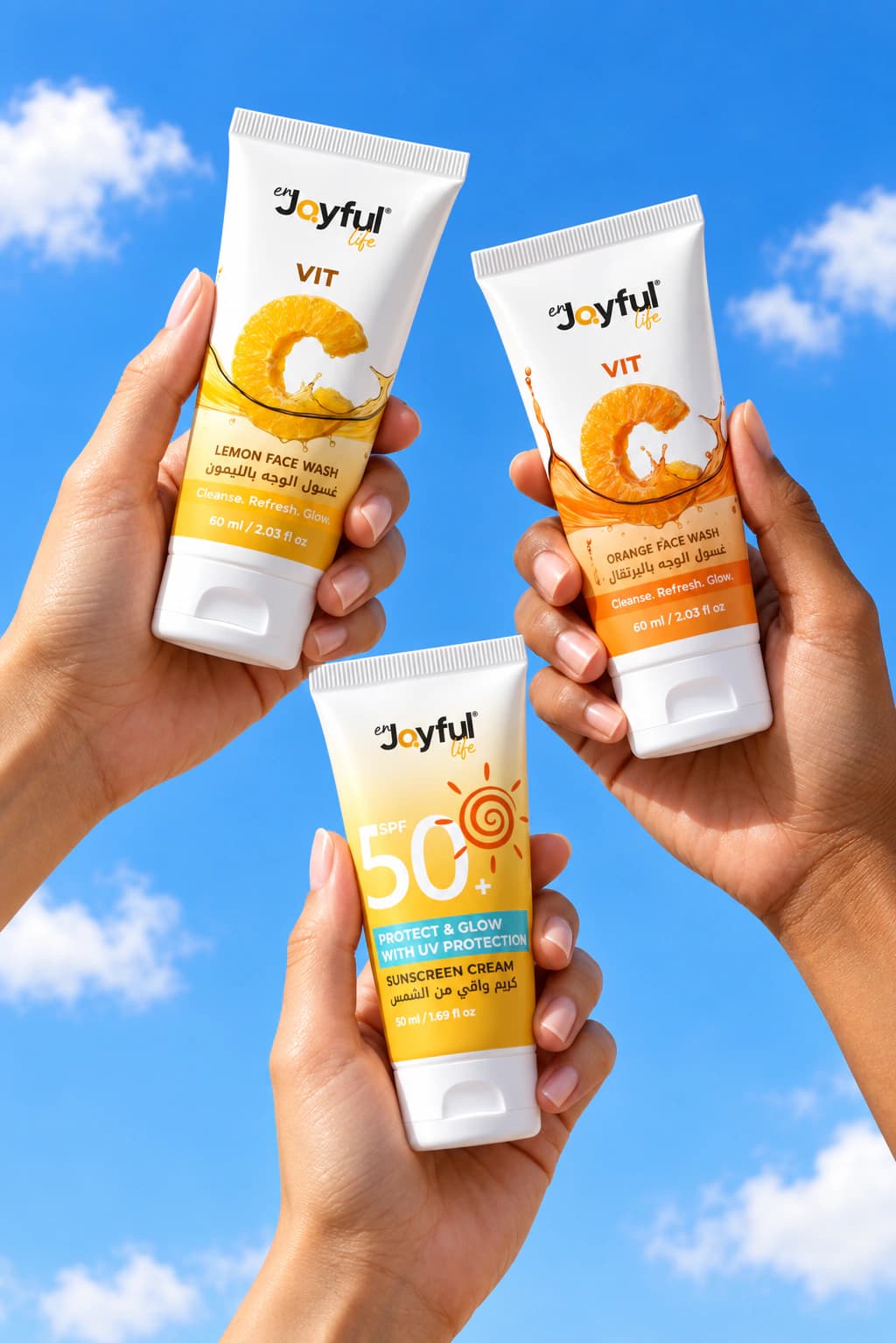Enjoyful Life Glow products held against a bright blue sky